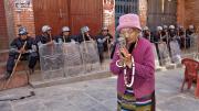 A Tibetan woman praying at the Boudhanath Stupa, near Kathmandu