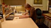 A book conservation specialist works on the preservation of rare books in Widener’s Conservation Lab, located in its basement.