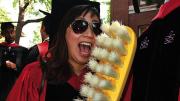 New doctor of medical sciences in oral biology (D.M.Sc.) degree-recipients Mindy Gil, D.M.D. &rsquo;11, of Palos Verdes, California, and Peter Charles Grieco, of Garfield, New Jersey, reminding revelers about good dental hygiene