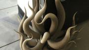 One sculpture acts as a kind of doorstop, greeting visitors from the ground.