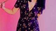 Karen Chee holding a flower to her face