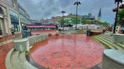 A red brick sunken pit in a plaza.