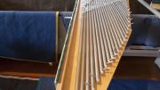 Pieces of the organ, rather than parishioners, fill the pews and aisles.