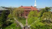 In Sever Quad, all paths converge on the Class of 1885 Gate. Sever Hall and Memorial Church  rise in the background. This view was taken from the roof of the Fogg Museum.