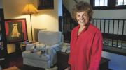 Ellen Langer at home, with her dogs and her own painting of a dog.