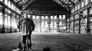 John Fetterman stands inside the defunct Carrie Furnance Works (1884-1982), which he hopes will be turned into  a museum and national park down the river from Braddock.