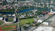 The Harvard campus, looking northeast toward Cambridge from the intersection of Western Avenue and North Harvard Street in Allston, where the mothballed science center dominates the right foreground. William James Hall looms in the distance.  [<a href="http://harvardmagazine.com/sites/default/files/375_so11_003_web_0.jpg">VIEW LARGER PHOTOGRAPH</a>]