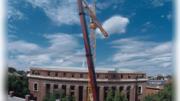 It takes one to build one. To assemble a 180-foot-high crane behind Widener Library, the crane in the foreground carefully hoisted a 300-foot-long boom from Massachusetts Avenue, where it had been pieced together, into place on high. The July 9 maneuver was reminiscent of a docking in space. Anthony C. Ferranti ’46, observing from his camera store across the street, opined, “This is the most exciting thing that’s happened in Harvard Square in years.”