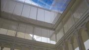 A rendering of the new building shows how the courtyard opens up to the glass lantern high above.