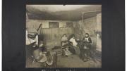 Lewis Wickes Hine, <i>Industrial Problems, Conditions: United States. Pennsylvania. Pittsburgh. Pittsburgh Survey: These Four Strippers Work in a Damp, Unventilated Cellar,</i> 1907–8. Gelatin silver print mounted to board, white gouache.