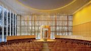 The interior of Temple Beth Elohim in Wellesley, Massachusetts, looking onto a wooded landscape