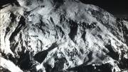 Aerial photographs taken by cartographer Bradford Washburn ’33 showed a shallow ridge that snaked vertically up the face of the Wickersham Wall. Marked on the photograph is the route taken by the Harvard team and the location of their camps.