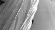 Above Camp Four, at about 8,800 feet, a Harvard climber ascends a fluted snow ridge.