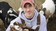 Max Sandvoss with some of his goats at the First Light Farm and Creamery in East Bethany, New York 