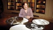 Porter University Professor Helen Vendler in Houghton Library with a copy of the Arion Press edition of John Ashbery's "Self-Portrait in a Convex Mirror"