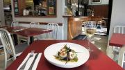 Strip T&rsquo;s nuanced fare, such as these sea scallops with yellow curry and chanterelles, is served in simple environs. 