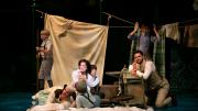 The Llewelyn Davies boys present a play of their own, with their mother, Sylvia (Laura Michelle Kelly) and Barrie in attendance.