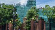 Photograph, renovating Harvard Hall, shown in protective construction wrapping