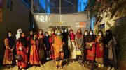 Rohingya students arriving at the AUW campus entrance 