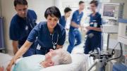 Stock photo, caring for patient in hospital bed