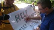 An ISS student gathers signatures in support of his team’s cause during a day-long fieldtrip to Tbilisi.
