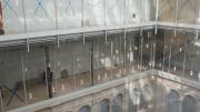 Glass walls in the upper stories of the courtyard afford oblique views into the art study and conservation spaces of this teaching museum, and allow natural light to diffuse through the interior.