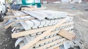 A stack of the Alaskan yellow cedar, custom milled in Newburyport, Massachusetts, and stained light gray, awaits installation.