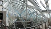A king-post truss system made of delicate-looking steel rods supports the glass roof, or lantern. Piano’s team refers to it as the “light machine,” because shades controlling the amount of natural light that enters through the roof are integral to the building’s mechanical systems.