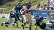 Eluding would-be tacklers Troy McClelland (25), Robbie Beathard (37), and Steve Gargiulo (90), Fischer streaked 30 yards down the sideline for a late-game score that gave Harvard a three-touchdown lead.