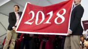 Undergraduate Council vice president Sietse Goffard ’15 (at left) and president Gus Mayopoulos ’15 present the freshmen with their class banner.