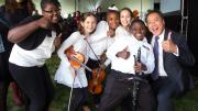 Ma strikes a pose with the student musicians.