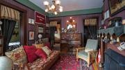 A view of the restored Franklin Delano Roosevelt Suite in Adams House. A piano was required because both FDR and his roommate belonged to the Glee Club.