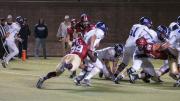 As the Crimson defense clamped down, Harvard's All-Ivy defensive end Zack Hodges (two of the Crimson's four sacks) wrapped up Holy Cross's slippery quarterback Peter Pujals. The Crimson limited the Crusaders to 147 yards in the second half. Hodges was Ivy League Defensive Player of the Year last season.