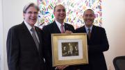 Dean Julio Frenk (left), Ali Ülker (middle), and Gökhan S. Hotamisligil (right). Ülker was presented with a picture of HSPH’s founders: George Whipple, William Sedgwick, and Milton Rosenau.