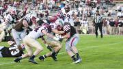 Ever in the Brown backfield, Scott Peters (44) and Connor Sheehan (50) headed a hard-hitting crew that limited the Bears to 88 yards on the ground.