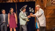 Physics winners David Hu and his team receive their prize from Dudley Herschbach.