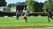 Pursued in vain by Brown's Will Twyman, Harvard quarterback Joe Viviano scampered for his second touchdown. 