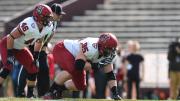 Defensive tackle Miles McCollum (95) and linebacker Sean Mackin were part of a Crimson defense that stingily held Brown to 74 net rushing yards.