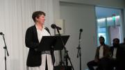 ArtLab director Bree Edwards at the microphone 