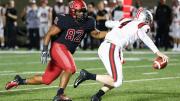 Hot pursuit: Harvard's Anthony Nelson (82) was one of a corps of sophomore defensive linemen to pressure Brown quarterback EJ Perry.