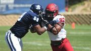 Standoff: Harvard junior defensive lineman Nasir Darnell (92) found his path blocked by San Diego's DJ Wright.