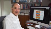 A portrait of Jerry Mitrovica at his desk