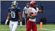 Harvard junior Aaron Shampklin (20) singed Georgetown defenders such as Jonathan Honore for 186 yards and two touchdowns.