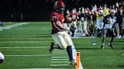 Junior Aidan Borguet skittering inside the pylon for the tying touchdown, his second of the game.