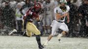 With wet snow veiling the Stadium's FieldTurf surface, tailback Treavor Scales '13 had his best game of the season against Dartmouth, rushing for 139 yards and two touchdowns. Cornerback Shawn Abuhoff is the Big Green defender.
