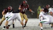 Linebacker and team captain Alex Gedeon (49) led the Crimson defense with eight tackles and a pass breakup. The other Harvard defenders are tackle Jack Dittmer (56) and linebacker Matt Martindale (45).