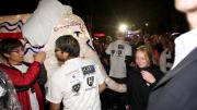 Students (including the author, in Crimson jacket) take the elephant through the parade in Harvard Yard.