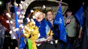 Lowell House co-masters Dorothy Austin and Diana Eck were carried by House residents in a rickshaw as part of the parade.