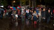 When the safety announcement was made, partygoers wondered whether it was more hazardous to stay outside in a lightning storm or to navigate the flooded Yard to make their way inside.