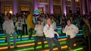 To get the evening's dancing started, a "flash mob" of dancers performed a choreographed routine they'd rehearsed throughout the previous week. The dancers were on the steps of Widener Library and at other Yard locations. Colorful LED lighting decorated buildings around the Yard.